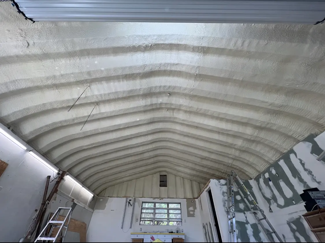 Spray polyurethane foam applied to the underside of a metal roof deck in Quartz Hill